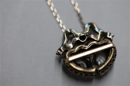 A 19th century gold, silver and diamond set twin hearts pendant, pendant 16mm.